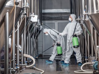 Disinfection of a factory. Photo by Prostock-studio/Shutterstock.com